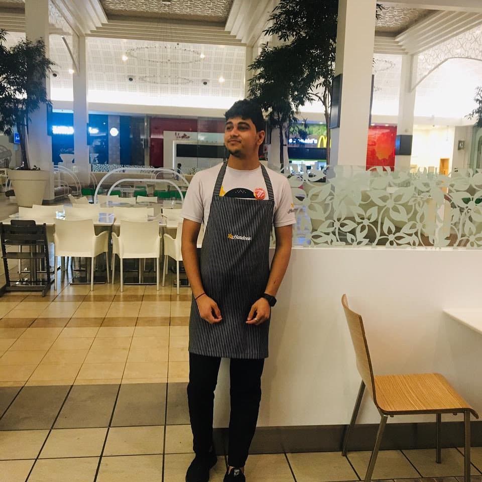Trushank Prajapati, Wings Institute alumnus working as F&B Staff at Hardees Dubai