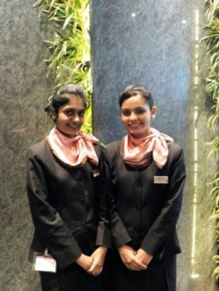 Divya Patel and Ms Honey Patel working at Bangalore International Airport.